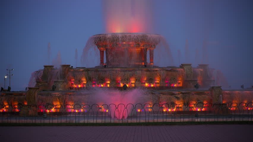 Element of Buckingham Fountain illuminated at night in downtown Chicago, Illinois.