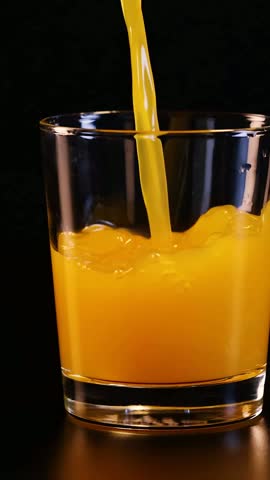 Juice being poured into a glass