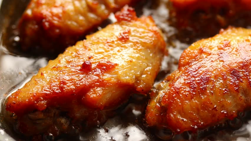 Frying Chicken Wings Without Flour In Hot Boiling Oil. Close up 