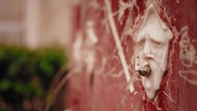 Ornate Marble Fountain in Valencia Spraying Fresh Water Through Carved Faces - Powered by Shutterstock - Get 15% off with code: PIKWIZARD15