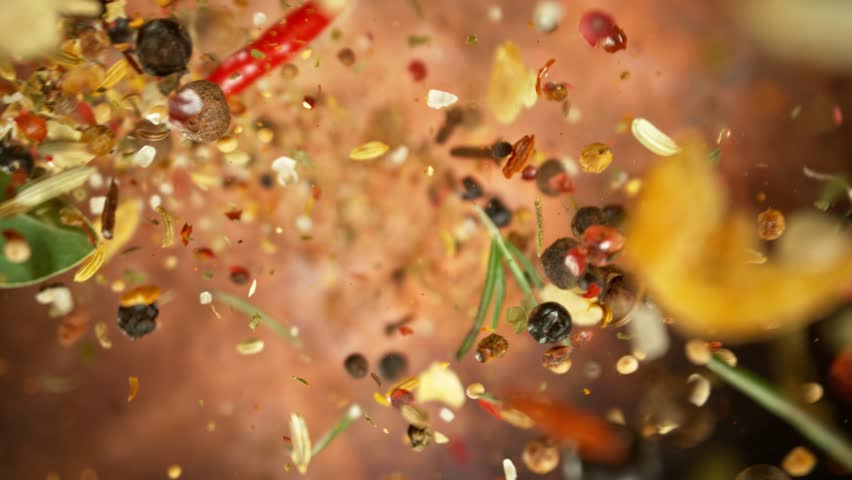 Super slow motion of rotating spices mix on black background. Ultimate realistic twister motion, studio shot. Filmed on high speed cinema camera, 1000 fps