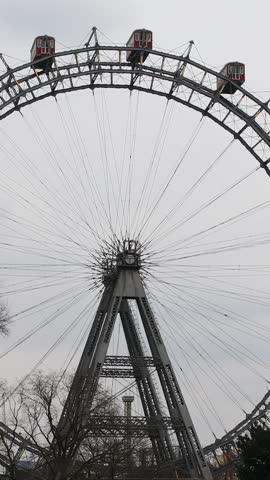 The historic Vienna Ferris Wheel in Prater park with its iconic red gondolas and steel frame was built in 1897 for Emperor Franz Josef I