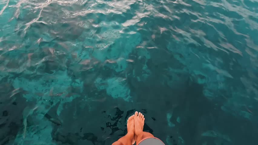 Jumping into the water - vacations and traveling at summer lifestyle and concept - holiday at the beach and swimming in the ocean