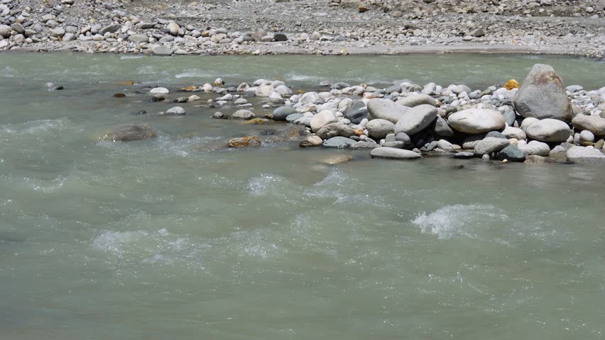 In Lahaul Valley, Himachal, the river water ripples amidst the rocky terrain