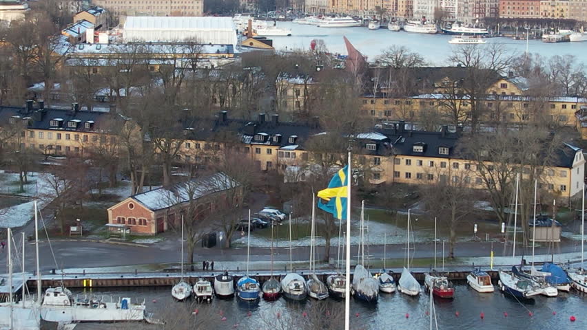 Drone view of Swedish flag and marina Stockholm, Sweden in Winter.