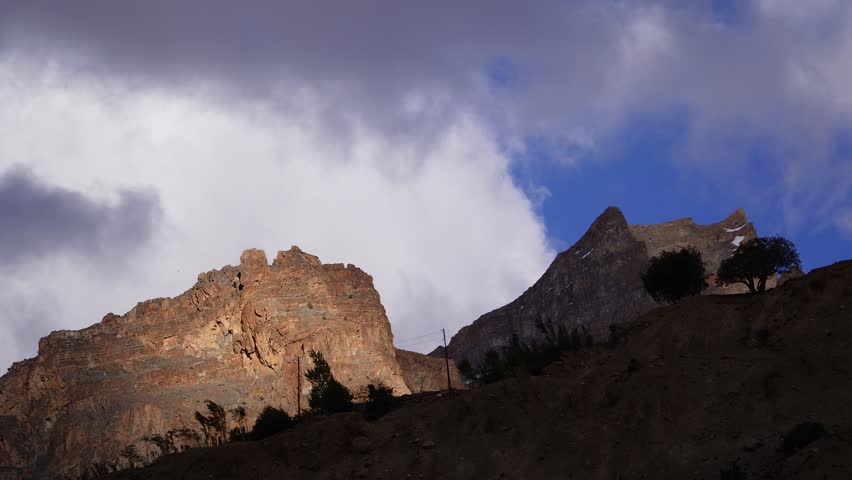 Time-lapse of clouds drifting gracefully over the mountains in Ladakh, India.