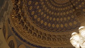 A panning shot inside the Amir Timur Museum in Tashkent, Uzbekistan, focusing on the stunning Islamic architectural details of the dome and ceiling - Powered by Shutterstock - Get 15% off with code: PIKWIZARD15