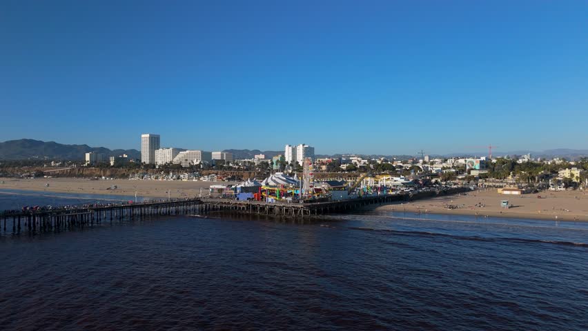 Wide beach overlooking the pier and the amusement park 