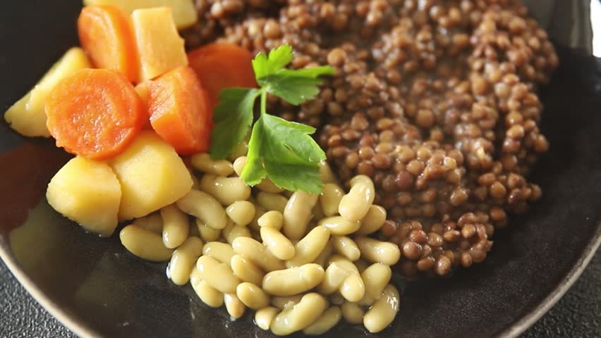 Lentils vegetarian main course vegetable, bean, potatoe, carrot tasty fresh delicious gourmet food background on the table rustic food top view copy space keto and paleo diet vegetarian and vegan 
