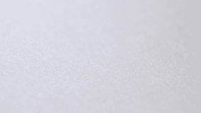 Close up of an antique calligraphy pen nib writing a thick black line. Slow motion of a classic vintage fountain pen drawing a curvy lines with ink absorbed by the parchment paper. - Powered by Shutterstock - Get 15% off with code: PIKWIZARD15