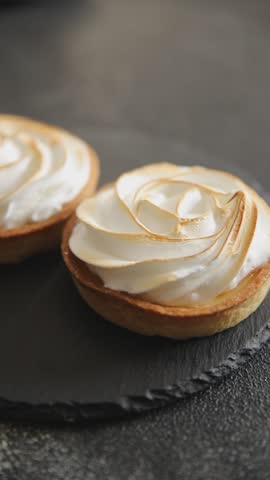 Lemon tart sweet dessert meringue, lemon curd pastry tasty fresh delicious gourmet food background table rustic food top view copy space