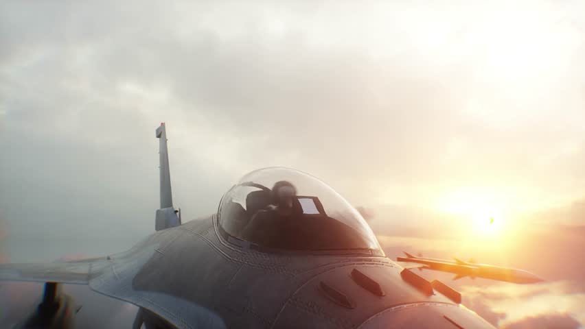 Military fighter jet F-16 flying over clouds. Air force.