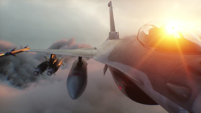 Military fighter jet F-16 flying over clouds. Air force.