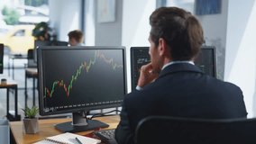 Stock trader looking monitors analyzing currency market charts in coworking workplace closeup. Bearded investor working at multiple computer screens. Businessman thinking on cryptocurrency investment. - Powered by Shutterstock - Get 15% off with code: PIKWIZARD15