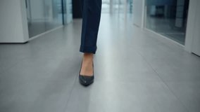Businesswoman legs walking office in high heels closeup. Unrecognizable lady manager in elegant formal black trousers going at vestibule. Unknown female director feet stepping corporate centre floor  - Powered by Shutterstock - Get 15% off with code: PIKWIZARD15
