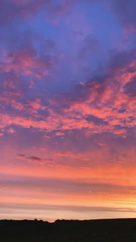 Beautiful dawn. Red sky. Soft pink dawn. Bright clouds in the sky.