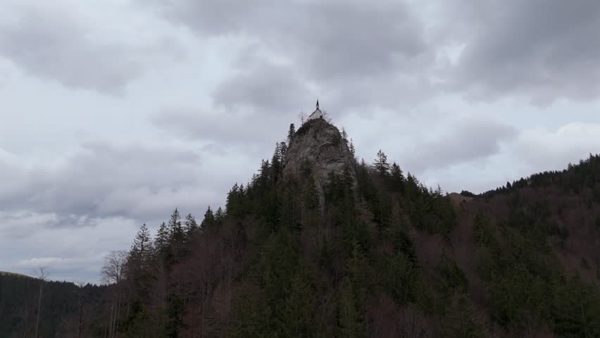 Riedersteinkapelle uber Tegernsee. Riederstein chapel small neo-Gothic church on cliff above Lake Tegernsee in Bavaria, Germany. Small white church on cliff in Alps. Aerial view Riederstein Kapelle. 