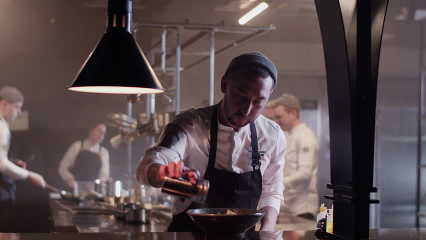 Professional chef preparing food for customer service in kitchen