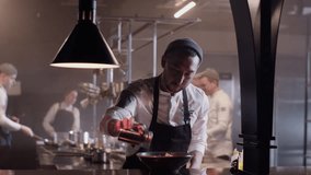 Professional chef preparing food for customer service in kitchen - Powered by Shutterstock - Get 15% off with code: PIKWIZARD15
