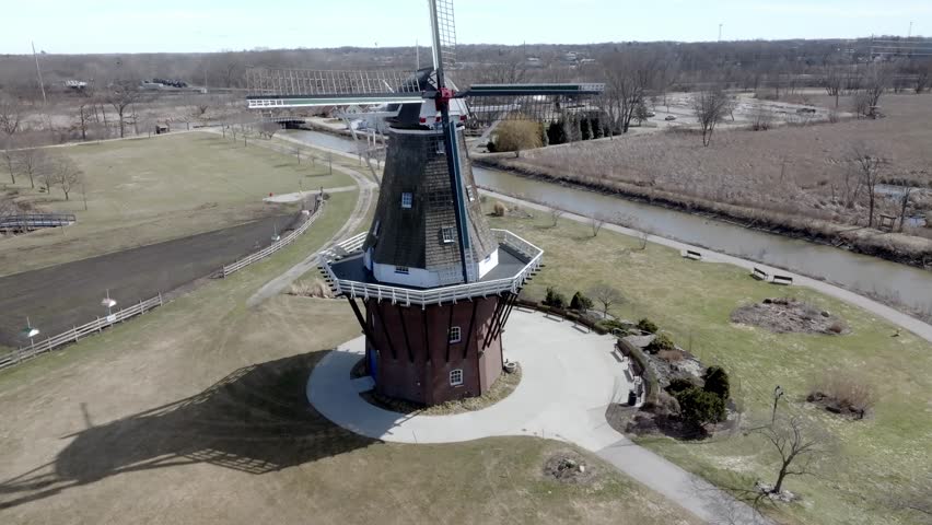 De Zwaan historic windmill in Holland, Michigan with drone video moving up.