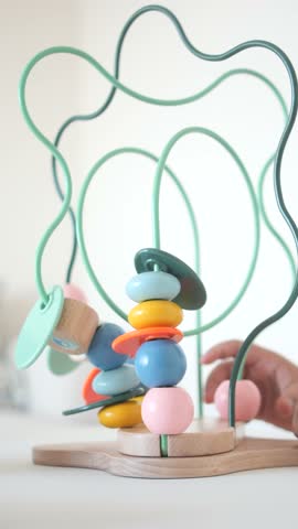 Engaging children with colorful bead maze activity in home setting