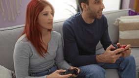 Young couple enjoying video games together on a sofa in a cozy living room, showcasing a friendly and relaxed indoor environment with man and woman casually engaged in play. - Powered by Shutterstock - Get 15% off with code: PIKWIZARD15