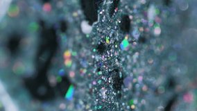 Vertical video. Shiny ink spill. Liquid glitter texture. Blur teal black color holographic sequin particles oil paint drip motion abstract art background with bokeh lights. - Powered by Shutterstock - Get 15% off with code: PIKWIZARD15