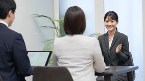A woman in a suit having a job interview - Powered by Shutterstock - Get 15% off with code: PIKWIZARD15