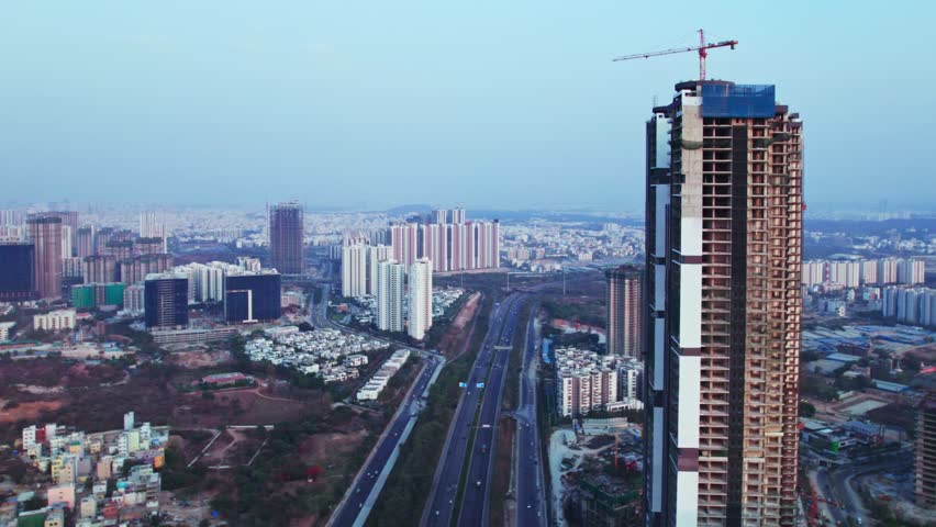 under construction Tallest building at Financial district, nanakramguda, hyderabad, telangana, india. day time, closeup, semi orbit, drone shot, 4k.