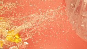 Juicy tasty sweet bright vibrant orange fly along on ice and water splashes drops in super slow motion. Cool rich juicy citrus cold oranges slices falling or exploding on pink background on 1000 fps - Powered by Shutterstock - Get 15% off with code: PIKWIZARD15