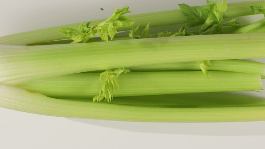 top view of green celery on white background zoom
