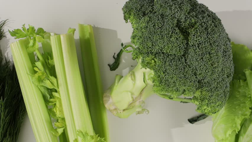 top view of green veggies on white background zoom