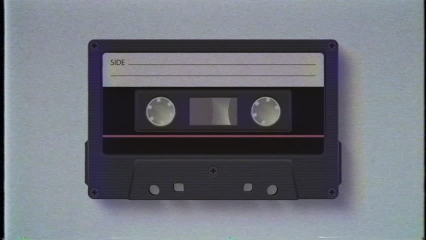 Vintage black audio cassette tape spinning in the background with noise and dust