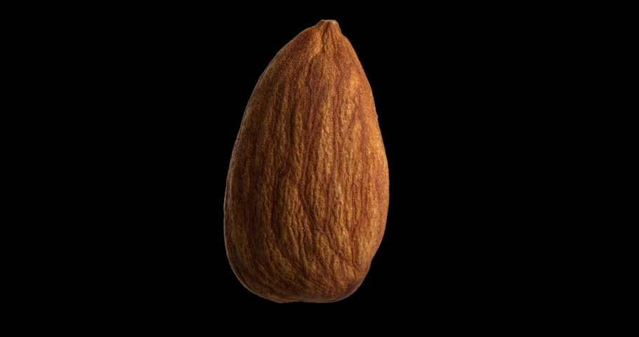 Almond nut rotating on black background.