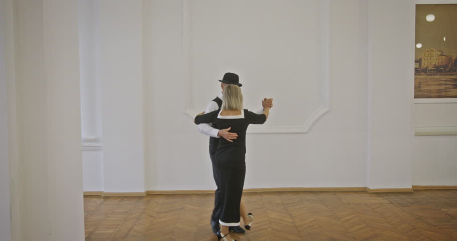 This is an Elegant Tango Dance Performance set in a Professional and formal environment