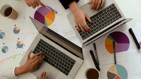 Teamwork in Business Analytics: Two Professionals Working on Laptops with Data Charts - Powered by Shutterstock - Get 15% off with code: PIKWIZARD15