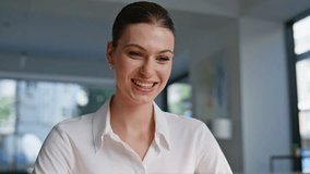 Smiling startuper reading papers at modern workplace closeup. Happy businesswoman reviewing documents feeling successful in office space. Beautiful woman manager holding good financial report indoors. - Powered by Shutterstock - Get 15% off with code: PIKWIZARD15