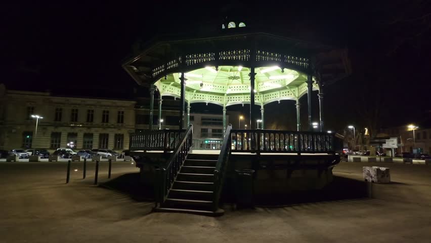 Illuminated bandstand in Laval, Square de Boston at night, France