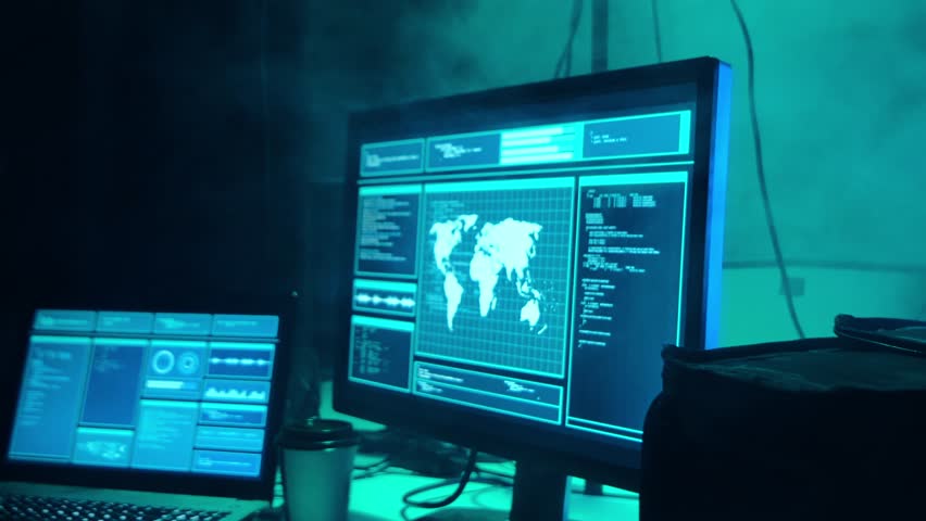 Wanted hackers coding virus ransomware using laptops and computers in the basement. Cyber attack, system breaking and malware concept. - Powered by Shutterstock - Get 15% off with code: PIKWIZARD15