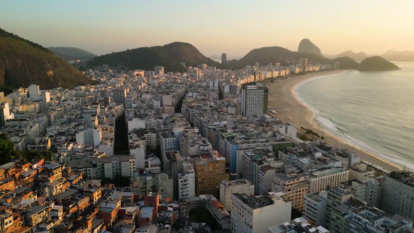 Aerial View of Cantagalo Slum and Copacabana District Below on Sunrise in Rio de Janeiro, Brazil