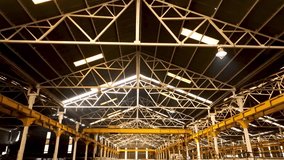 Steel Beam Architecture of Giant Industrial Warehouse with Dramatic Light and Shadows - Powered by Shutterstock - Get 15% off with code: PIKWIZARD15
