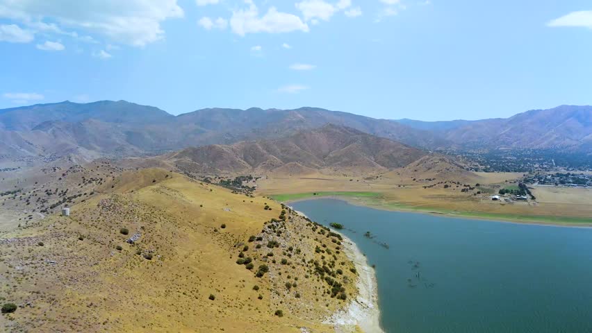 Lake Isabella, Sierra Nevada, Kern County, California - A Lake Nestled in a Valley, Surrounded by Golden Hills and Rugged Mountains - Aerial Drone Shot