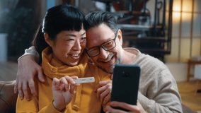 Interracial happy couple showing their family positive pregnancy test on a phone video call - Powered by Shutterstock - Get 15% off with code: PIKWIZARD15
