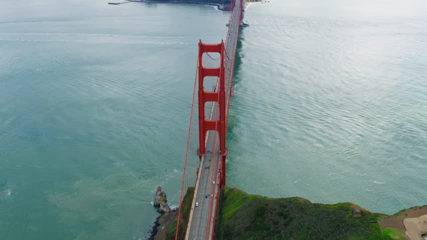High aerial view of the Golden Gate Bridge. San Francisco, US. It connects the San Francisco Bay to Marin County. US route 101 and SR 1 full of traffic. Shot on Red weapon 8K.