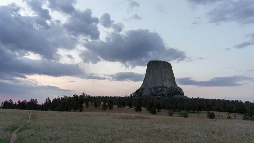 Timelapse Sunrise over Devils Tower National Monument with dramatic clouds