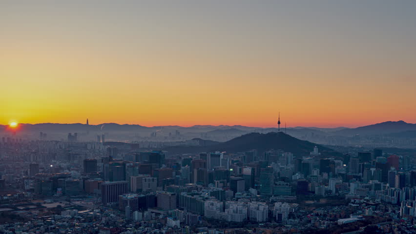 View from the mountaintop in Seoul, South Korea and the morning sun with clear sky and clear view of Seoul.