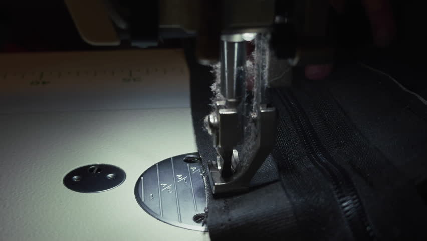 Tailor Sews Art of Fabric with Sewing Machine