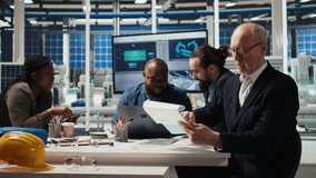 Industrial plant senior manager looking over paperwork files. Elderly factory executive reading documents, meeting with investors to discuss automating production, camera A - Powered by Shutterstock - Get 15% off with code: PIKWIZARD15