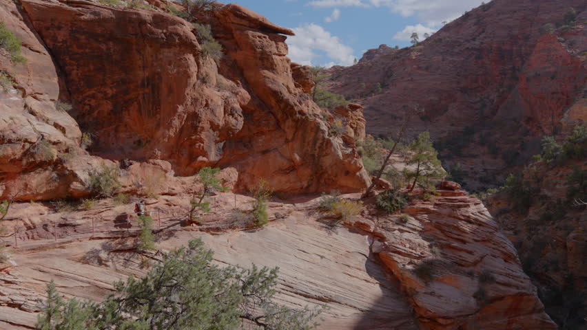 A breathtaking scenic view of Zion National Park beautifully showcasing its stunning rock formations along with its rugged and challenging trails that are perfect for passionate hiking enthusiasts