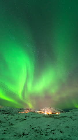 Vertical View Of Dramatic Sky With Aurora Borealis Near Kvaloyvaagen, Norway. Timelapse